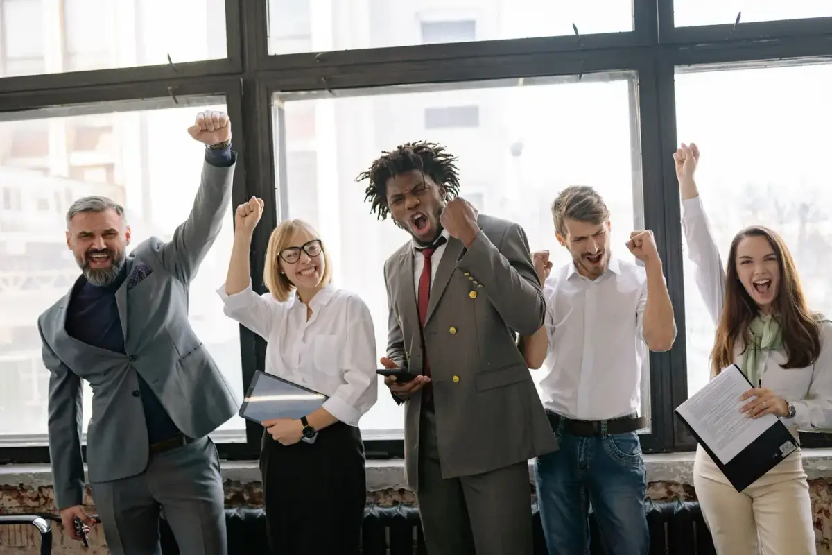 A diverse office team celebrating a success together