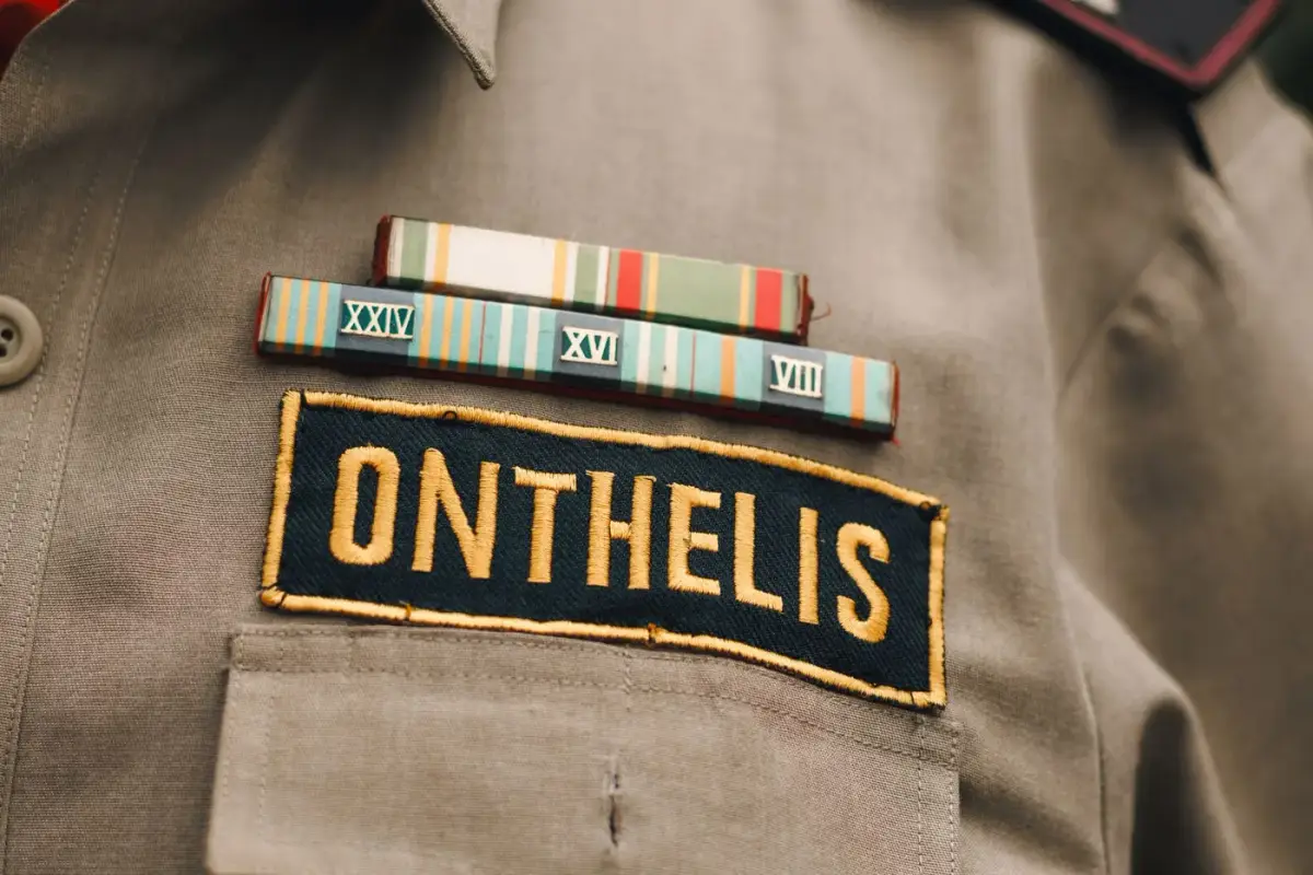 A uniform shirt showing a woven name tape and ribbon bar