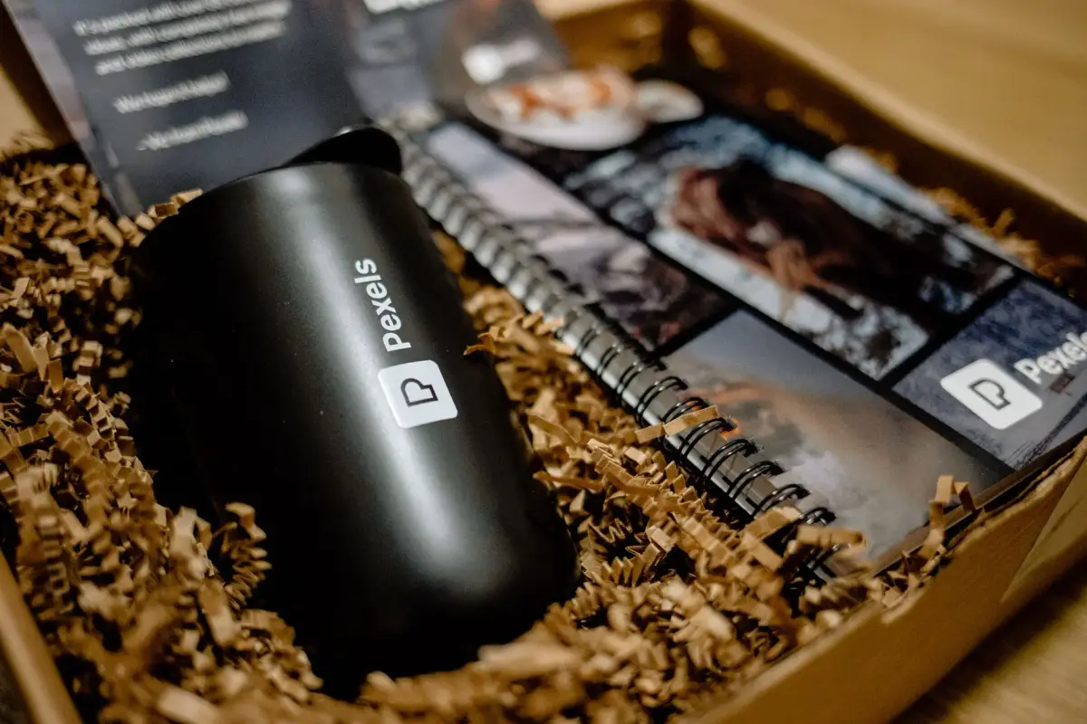 A branded welcome kit with apparel packed in a box for a new hire