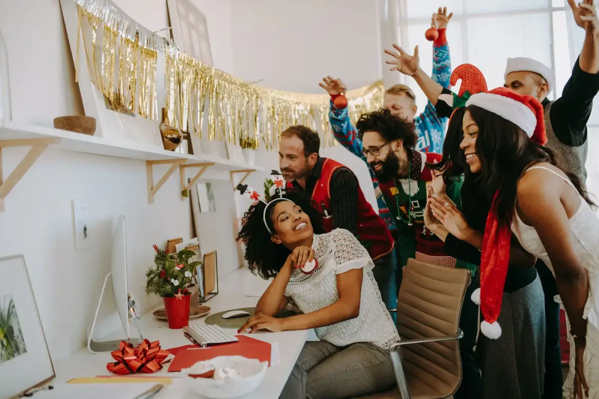 A team celebrating together at a company holiday party